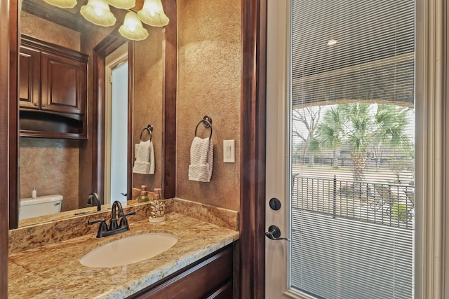 bathroom with vanity and toilet