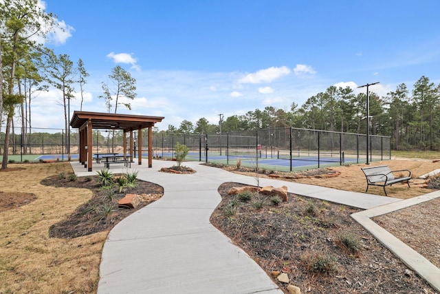 surrounding community featuring tennis court and a gazebo