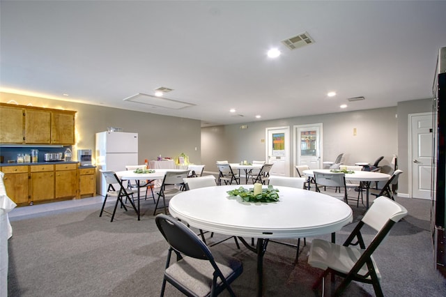 view of carpeted dining space