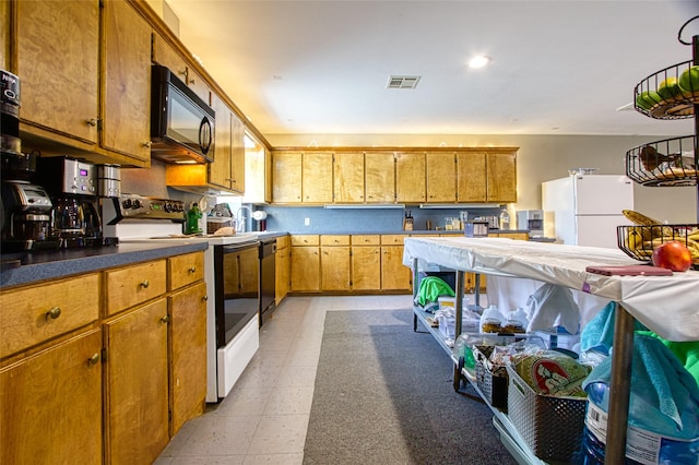 kitchen with sink and black appliances