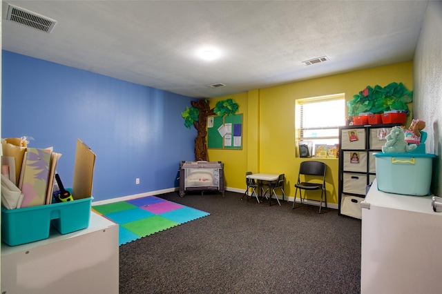 game room featuring dark colored carpet