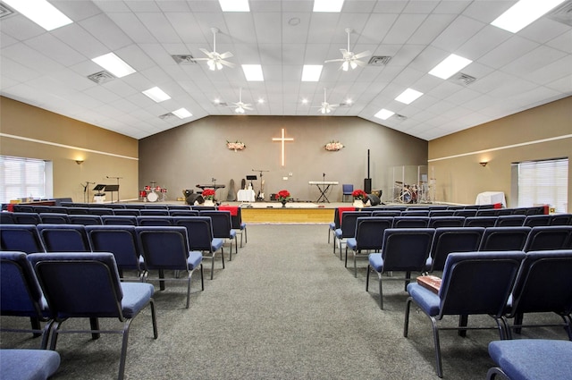 miscellaneous room with vaulted ceiling, carpet, and ceiling fan