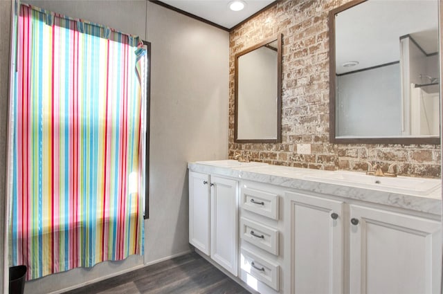 bathroom featuring hardwood / wood-style flooring and vanity