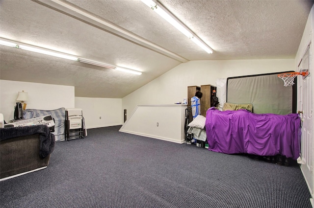 bedroom with lofted ceiling, a textured ceiling, and dark carpet