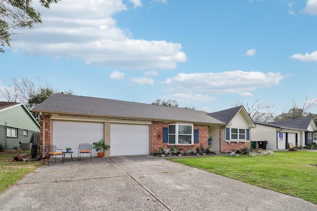 ranch-style home featuring a garage and a front lawn