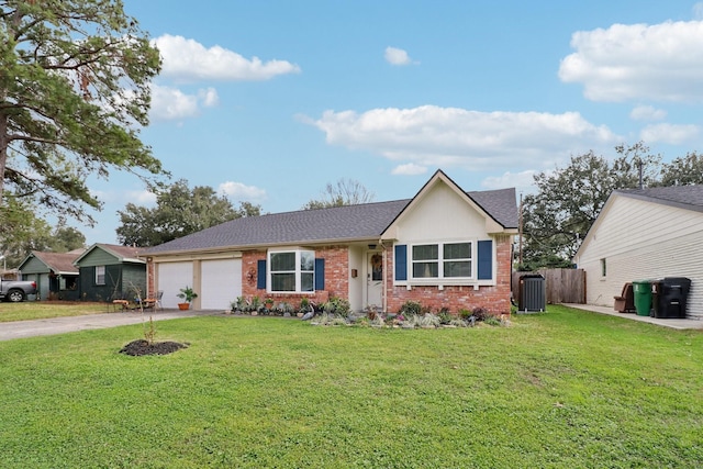 ranch-style home with a garage, a front yard, and central AC unit