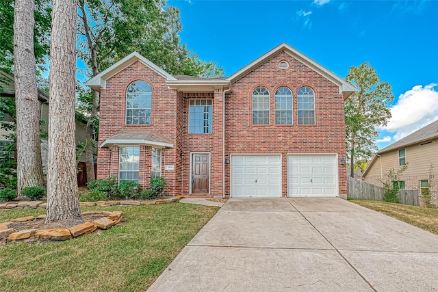 front of property featuring a garage and a front yard