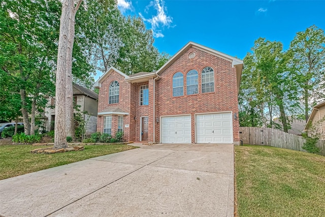 view of front property with a garage and a front yard