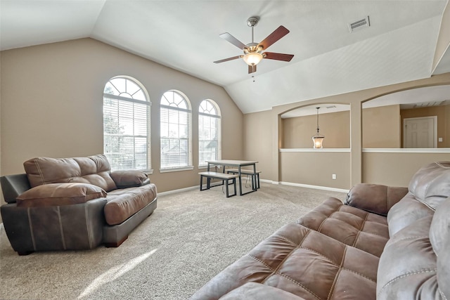 carpeted living room with lofted ceiling and ceiling fan