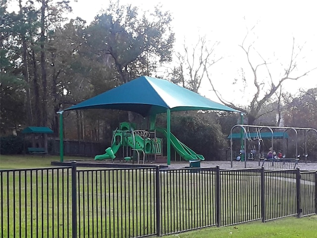 view of playground with a lawn