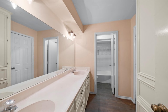 bathroom with vanity and hardwood / wood-style flooring