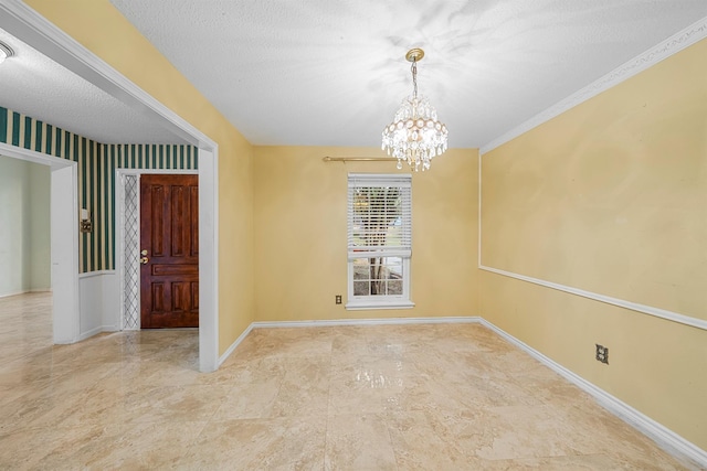 interior space with a textured ceiling and a notable chandelier