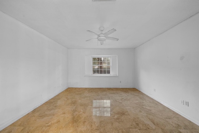 unfurnished room with ceiling fan