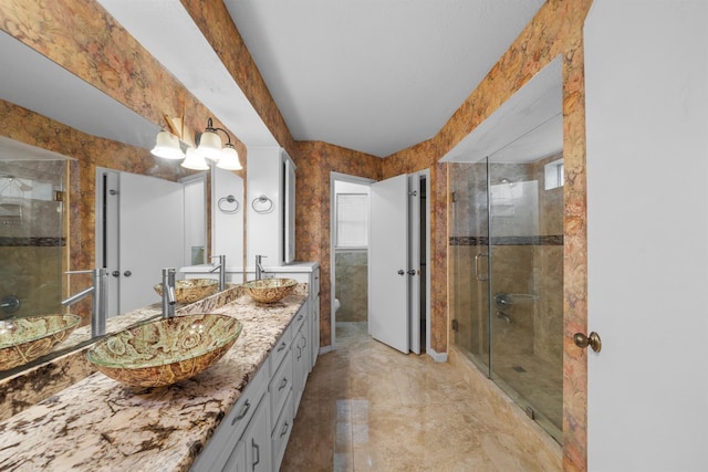 bathroom with vanity, a shower with shower door, and toilet