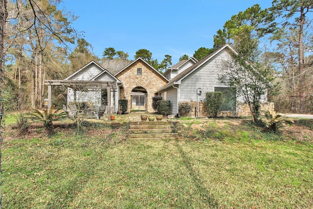 view of front of property featuring stone siding and a front lawn