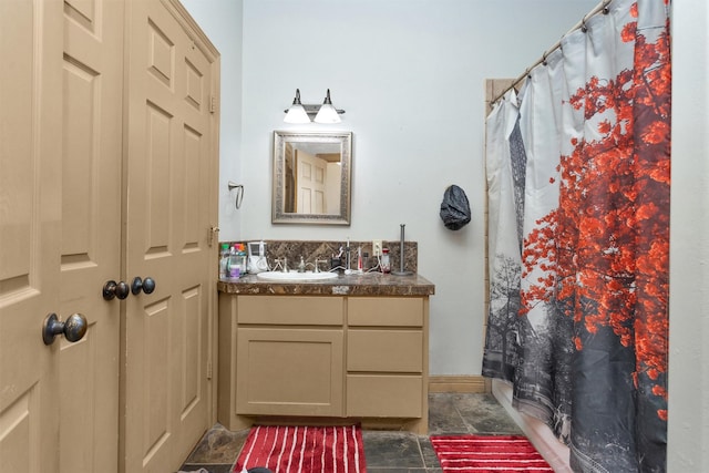 bathroom with curtained shower and vanity