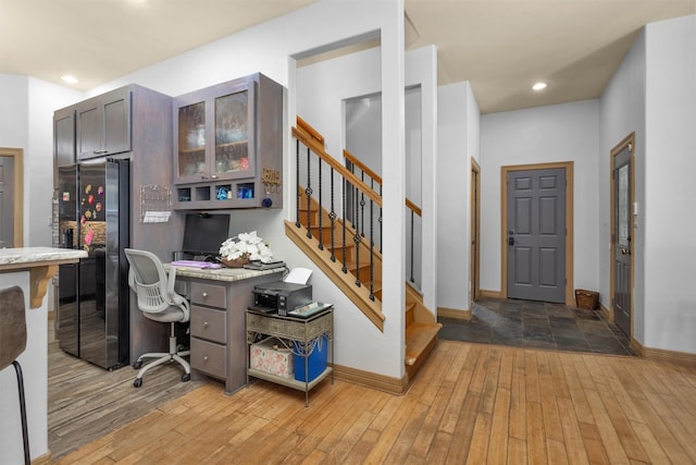 office featuring light wood-style floors, baseboards, and recessed lighting