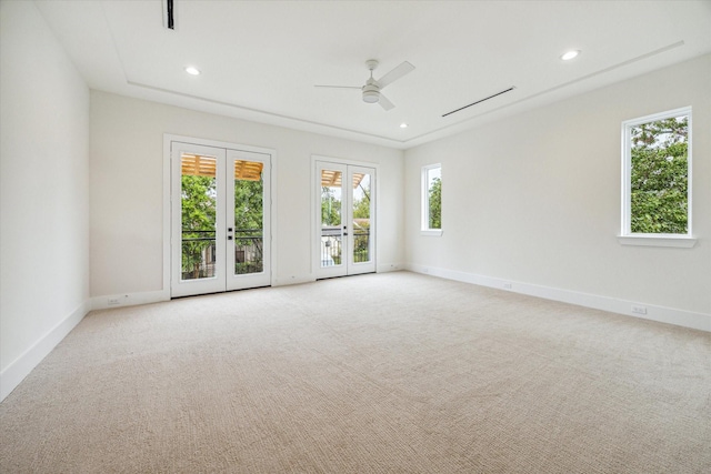 unfurnished room featuring recessed lighting, baseboards, light colored carpet, and french doors