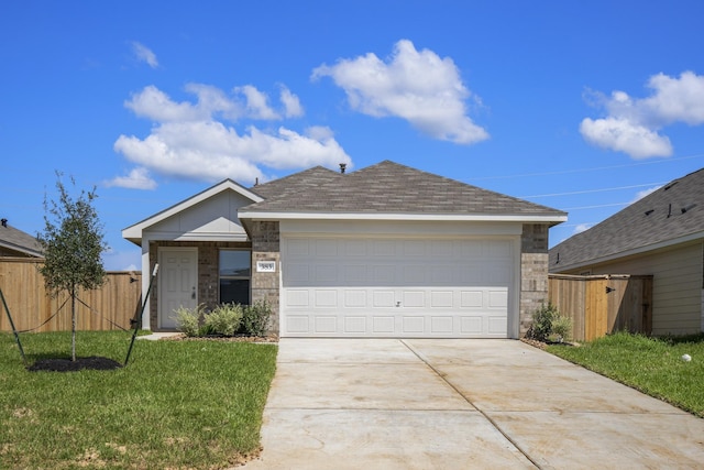 single story home with a garage and a front yard