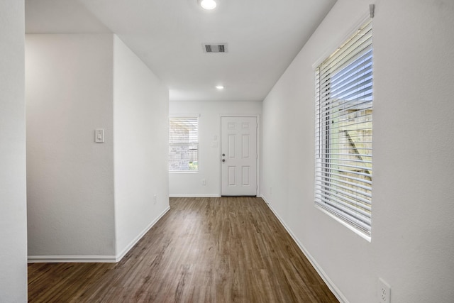 hallway featuring dark hardwood / wood-style flooring