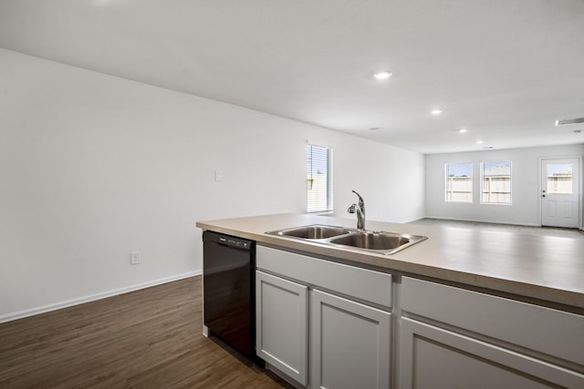 kitchen featuring dark hardwood / wood-style flooring, dishwasher, sink, and gray cabinetry