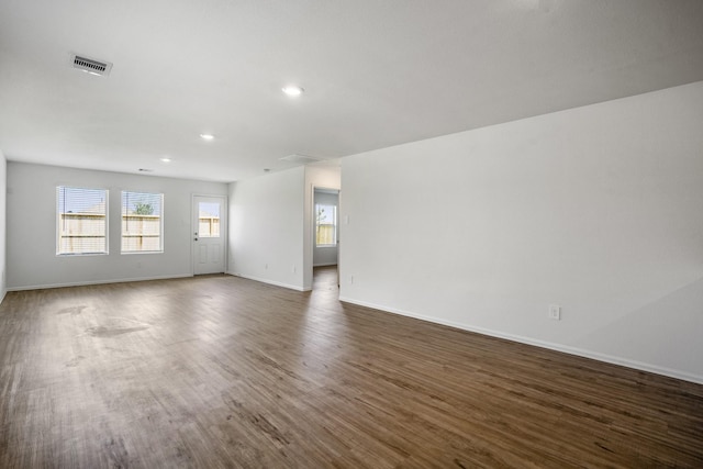 empty room featuring dark wood-type flooring