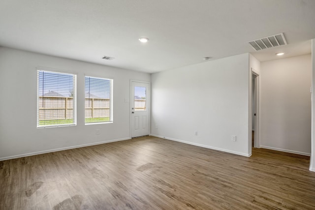 unfurnished room featuring dark hardwood / wood-style flooring