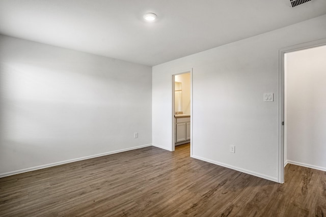 spare room with dark hardwood / wood-style flooring