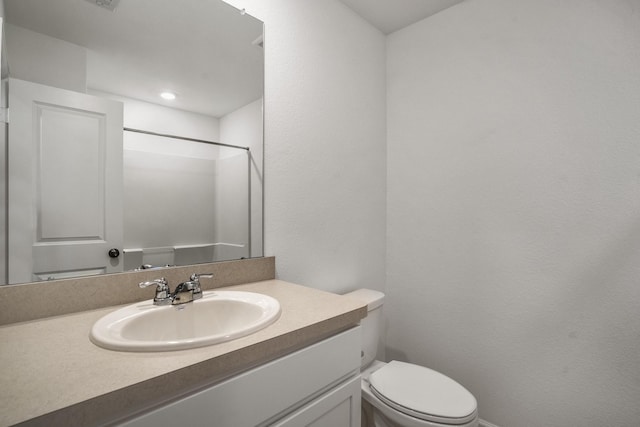 bathroom with vanity and toilet