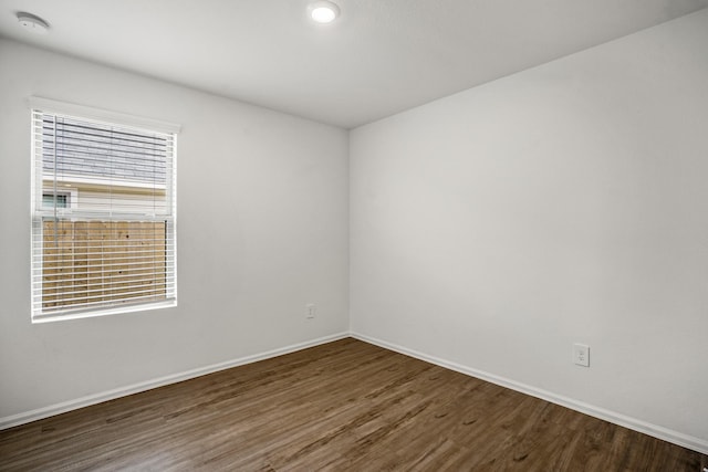 unfurnished room featuring dark hardwood / wood-style floors