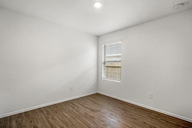 empty room featuring dark hardwood / wood-style floors