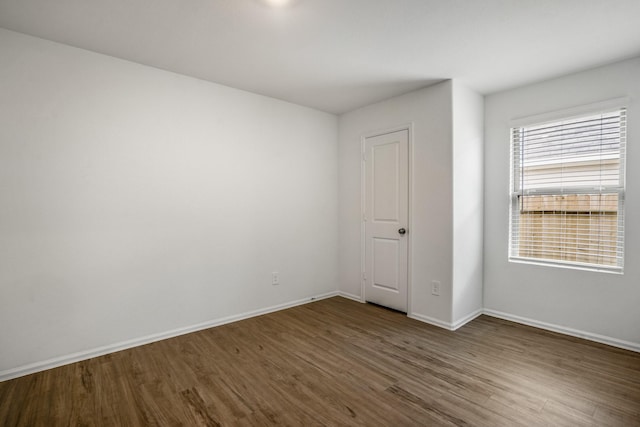 empty room featuring dark hardwood / wood-style floors