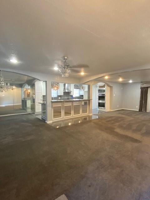 unfurnished living room featuring carpet