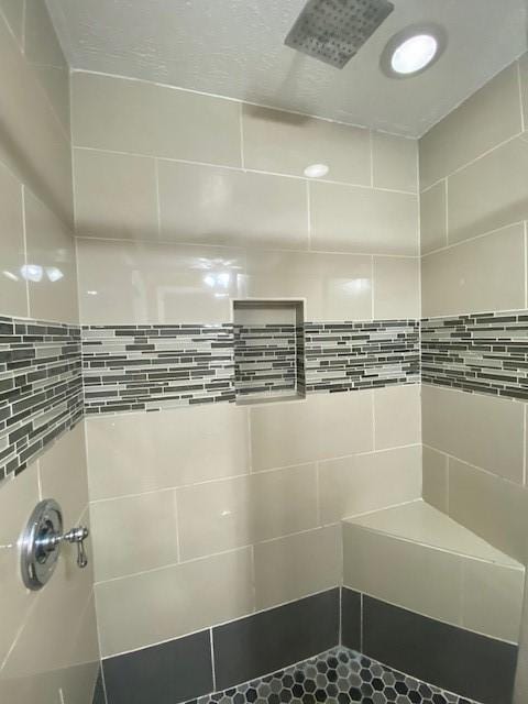 bathroom with a tile shower