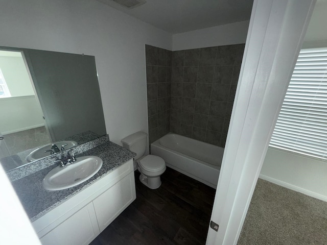 bathroom featuring vanity, wood-type flooring, and toilet