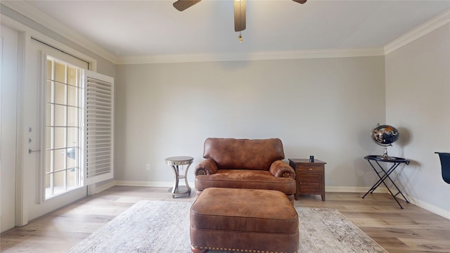 sitting room featuring ornamental molding, ceiling fan, and light hardwood / wood-style flooring