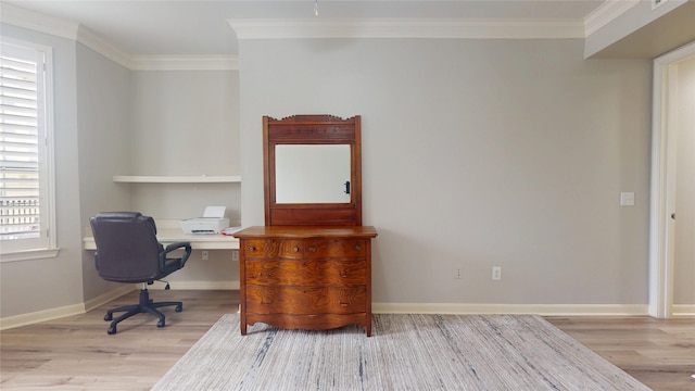 office area featuring crown molding and light hardwood / wood-style flooring