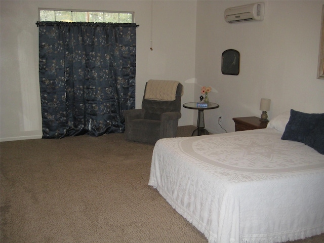 bedroom with an AC wall unit and carpet