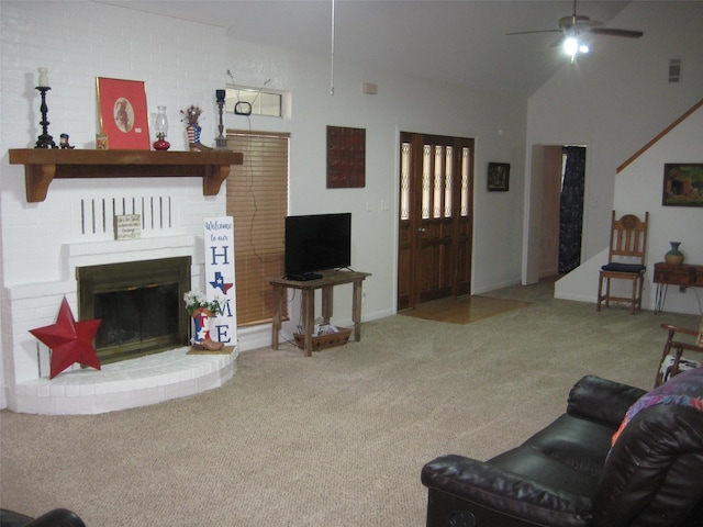 living room with ceiling fan, a brick fireplace, high vaulted ceiling, and carpet