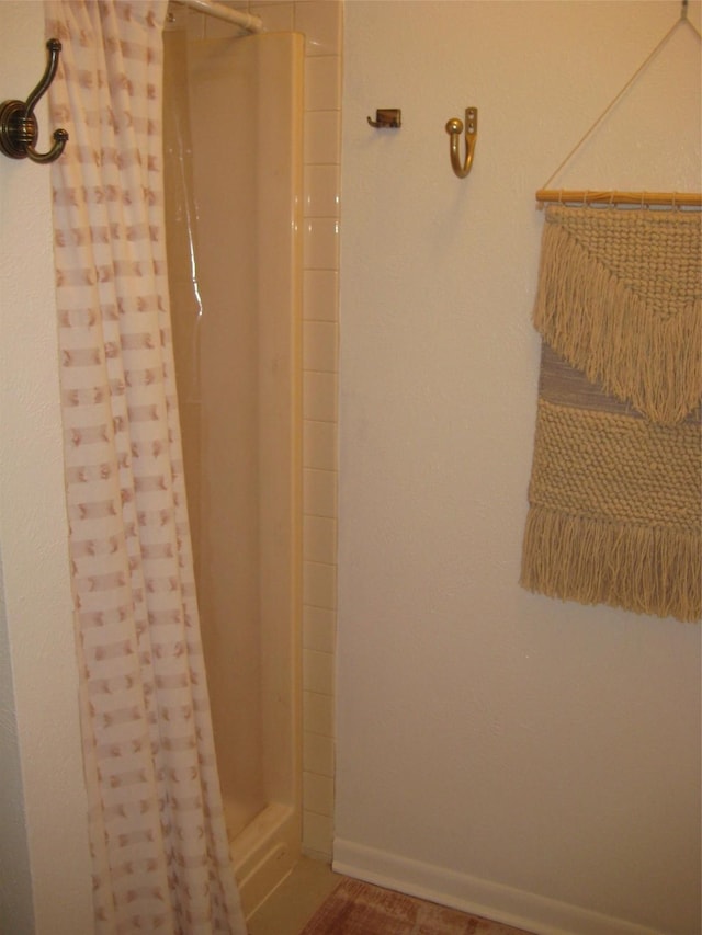 bathroom with a shower with curtain