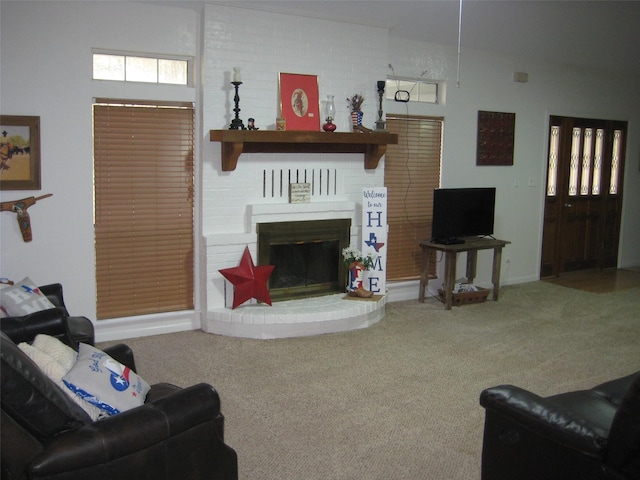 carpeted living room featuring a brick fireplace