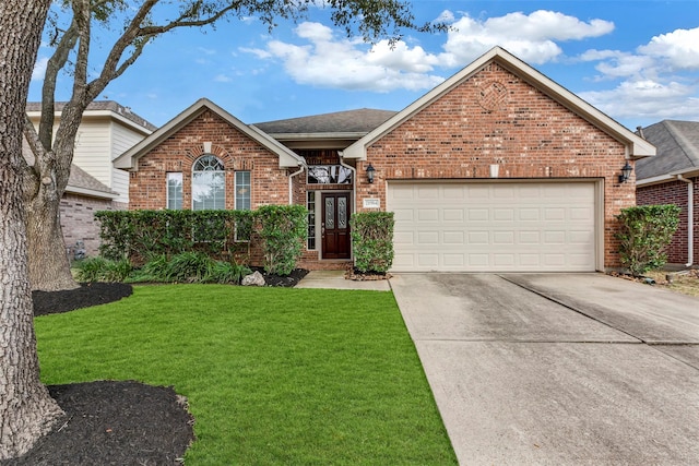 front facade featuring a garage and a front lawn