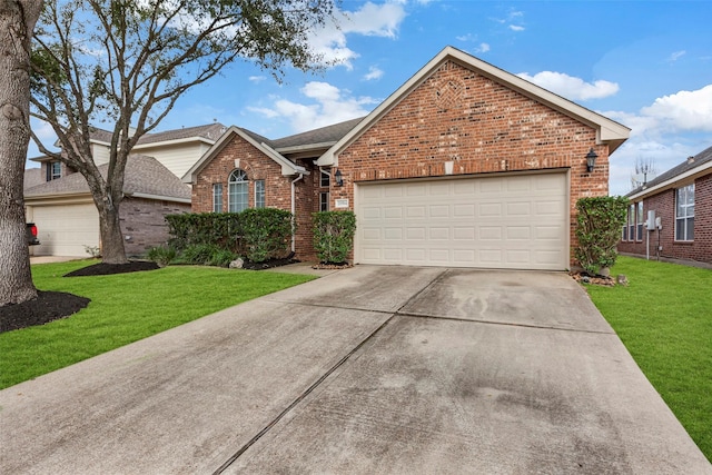 view of property featuring a garage and a front lawn