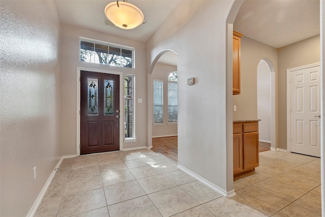 foyer with light tile patterned floors