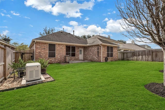 back of property featuring a lawn and a patio area