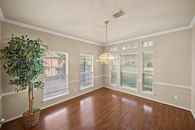 unfurnished dining area featuring ornamental molding and wood-type flooring