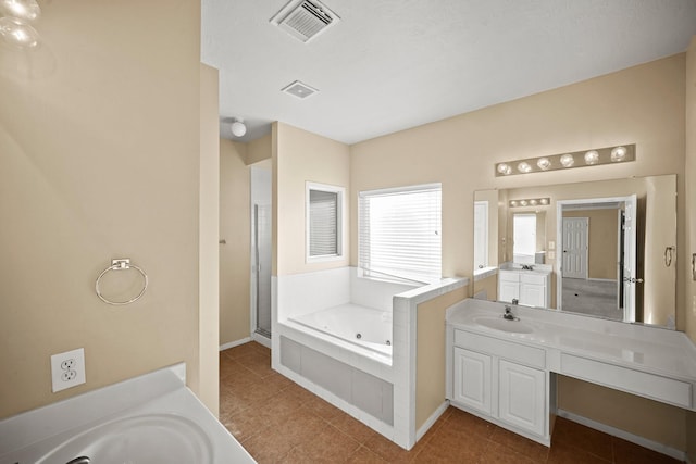 bathroom with vanity, shower with separate bathtub, and tile patterned flooring