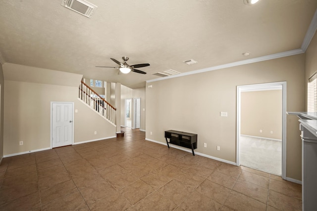 unfurnished living room featuring plenty of natural light, ornamental molding, and ceiling fan