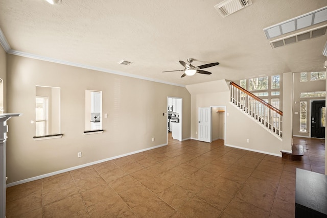 unfurnished living room featuring ceiling fan, ornamental molding, and a textured ceiling