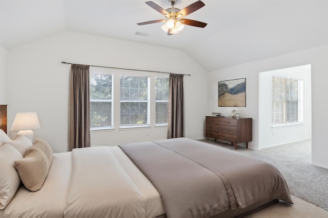 carpeted bedroom featuring vaulted ceiling and ceiling fan